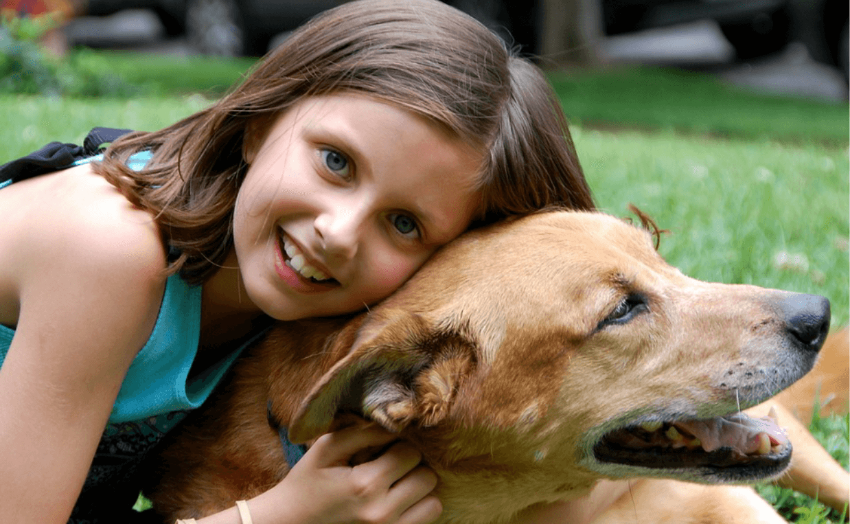 girl loving her dog