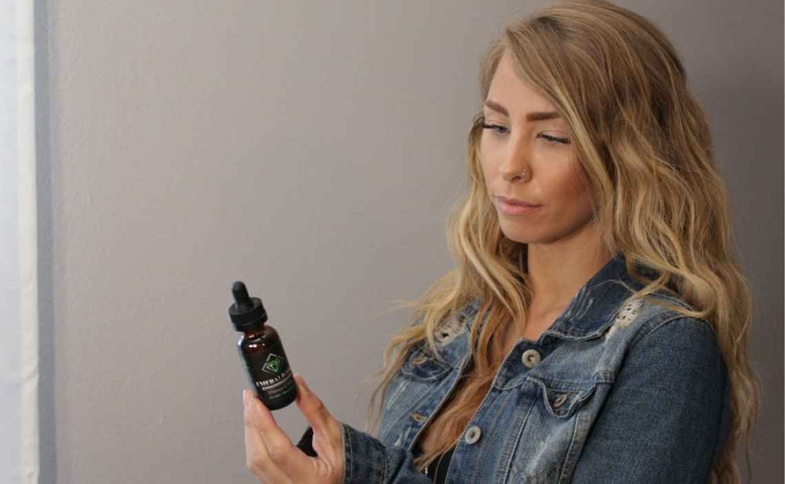 woman wondering if she should give her dog cbd oil