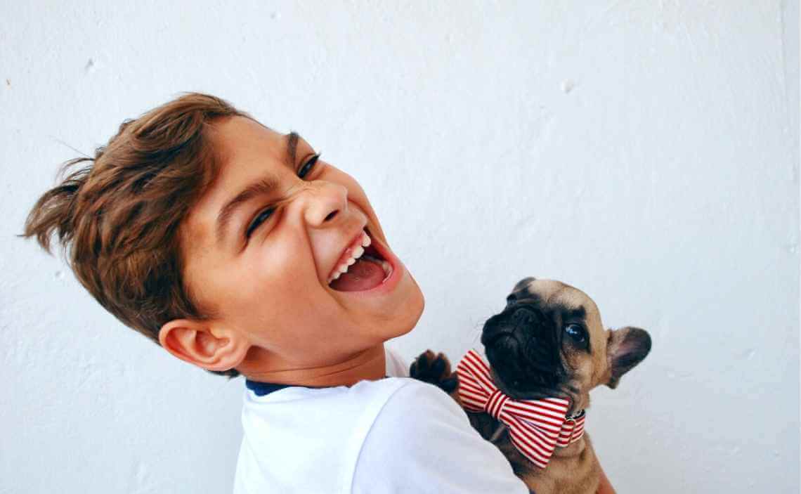 LAUGHING BOY WITH PUPPY