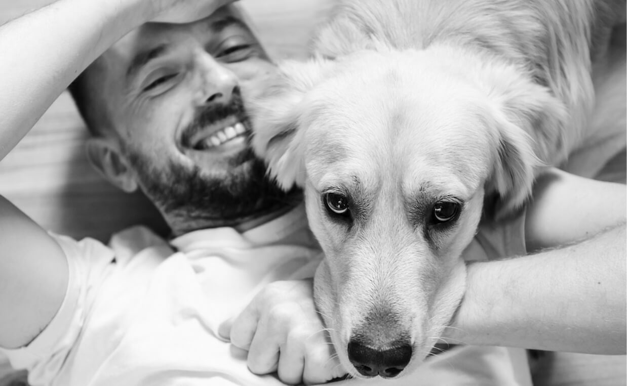 man with dog black and white pic foster dog