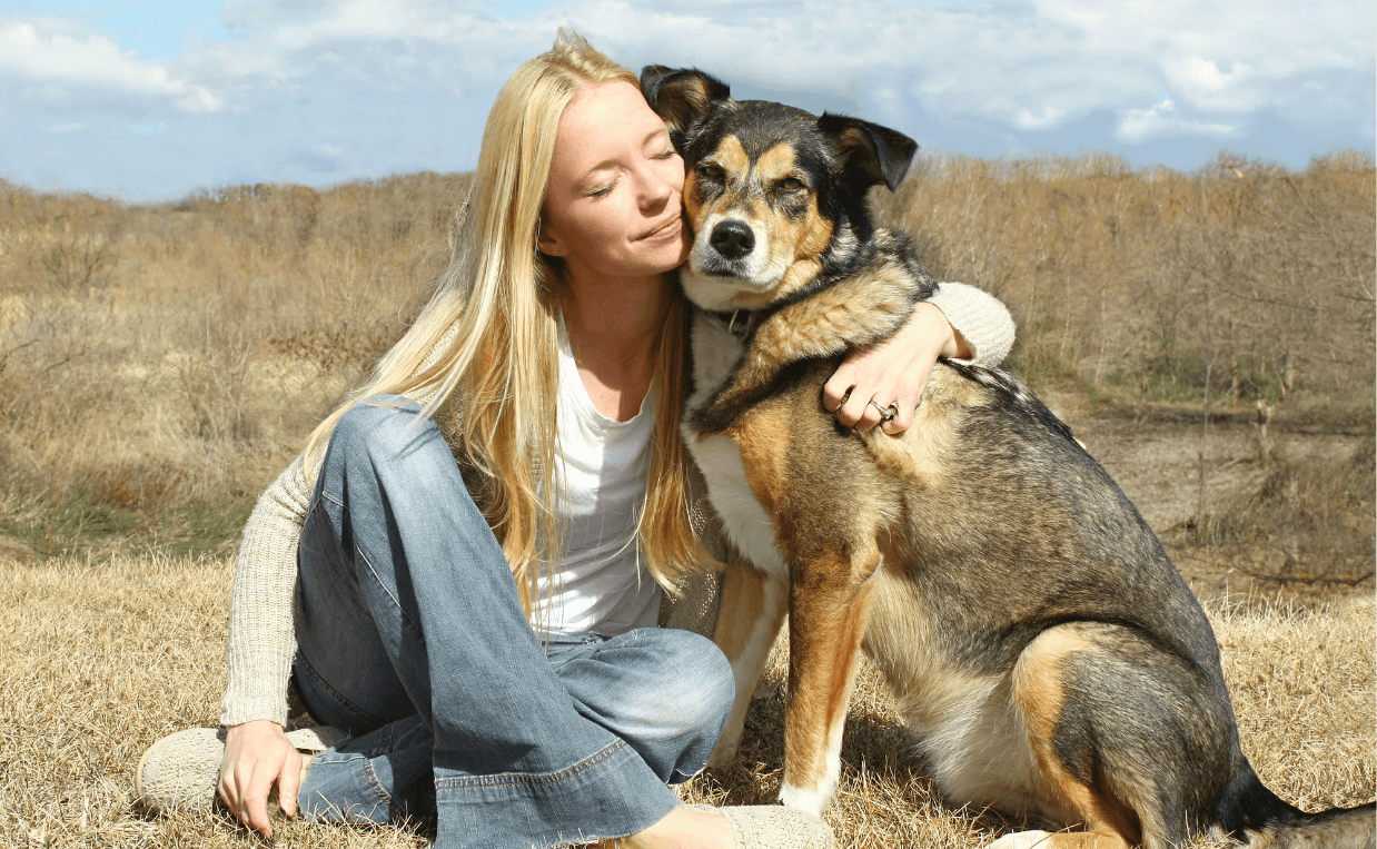 dog and woman showing love and affection
