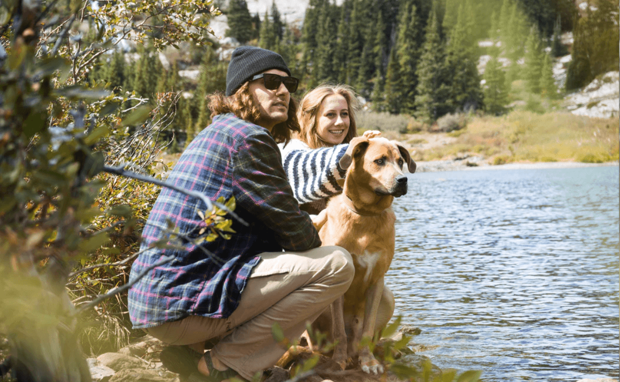 COUPLE WITH DOG OUTSIDE