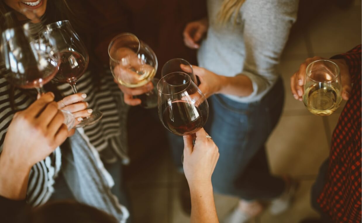 people drinking wine at a party