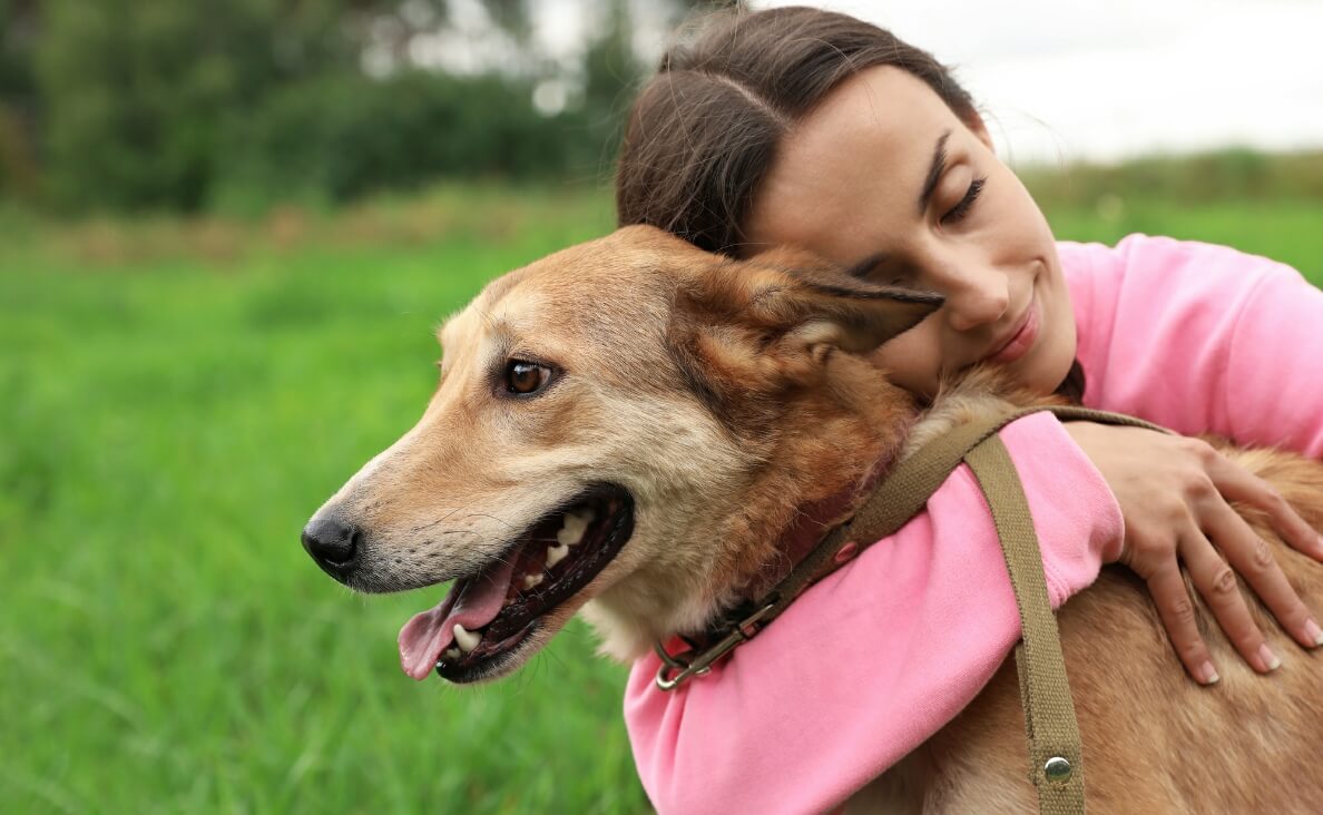 woman hugging her dog